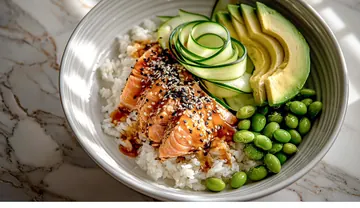 Sesame salmon rice bowl with edamame and avocado